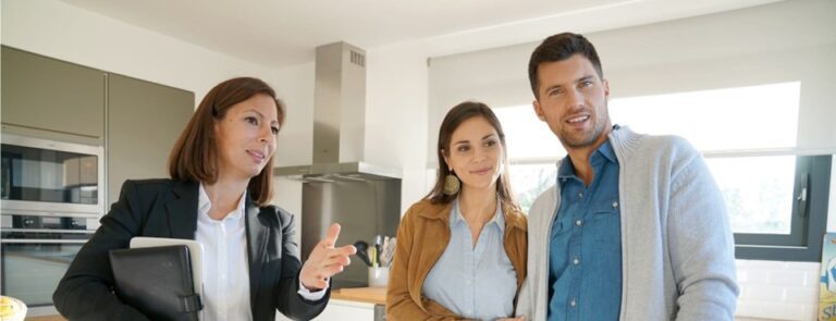 A real estate agent shows off a home