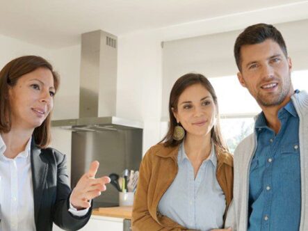 A real estate agent shows off a home